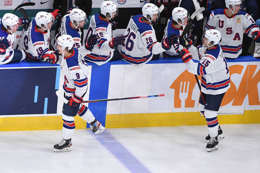 Trevor Zegras and Alex Turcotte of USA celebrate the team's