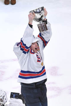 Cam York of USA hoists the first place trophy