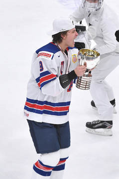 Trevor Zegras of USA celebrates with the first place trophy
