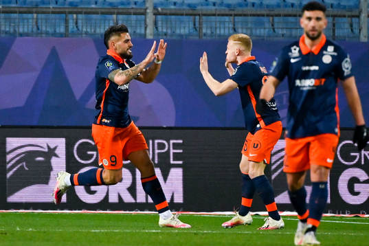 Andy DELORT of Montpellier celebrates his scoring with