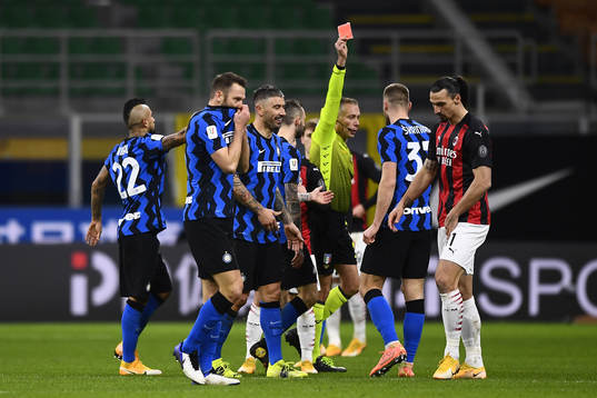 Zlatan Ibrahimovic of Milan receives a red card