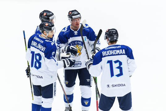 Juuso Puustinen of Finland celebrate with teammates