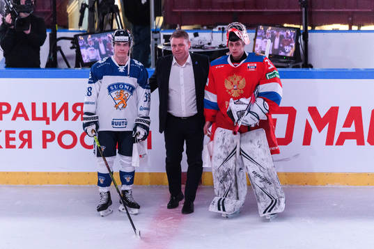 Jere Innala of Finland and goalkeeper Alexander Samonov of