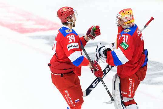 Daniil Misyul and goalkeeper Alexander Samonov of Russia