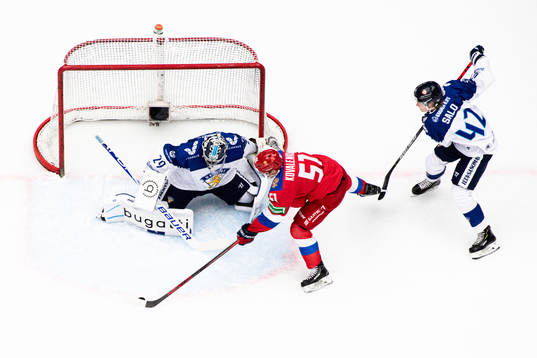 Nikolai Kovalenko of Russia and goalkeeper Harri Säteri of
