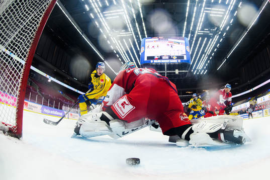 Albert Johansson of Sweden scores the 3-2 goal behind