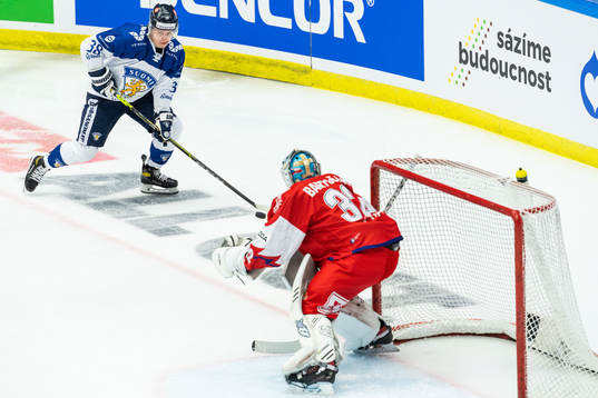 Jere Innala of Finland and goalkeeper Patrik Bartosak of