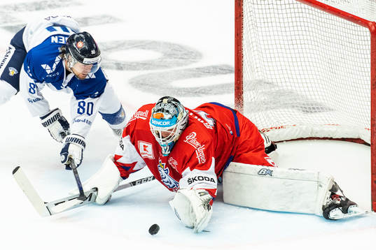 Teemu Turunen of Finland and goalkeeper Patrik Bartosak of