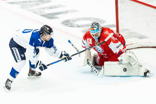 Teemu Turunen of Finland and goalkeeper Patrik Bartosak of