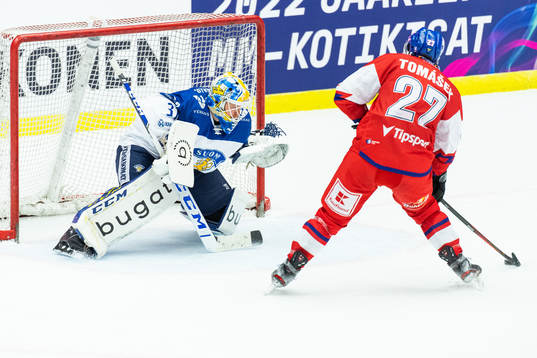 Penalty shot with goalkeeper Janne Juvonen of Finland and