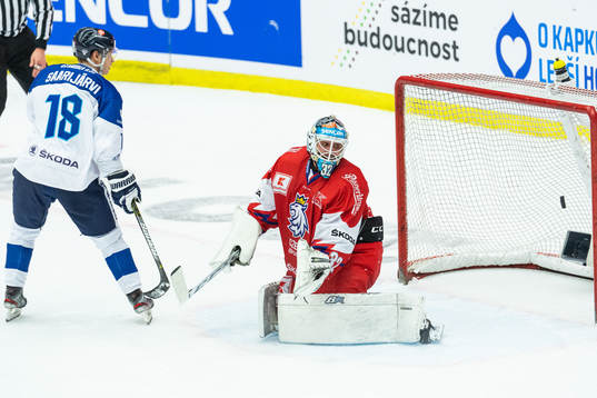 Vili Saarijärvi of Finland scores a penalty behind Filip