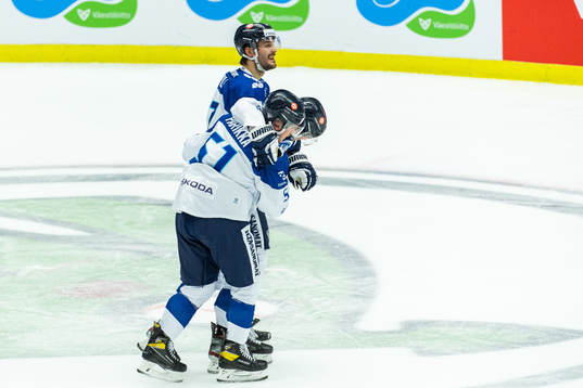 Otso Rantakari of Finland is helped of the ice