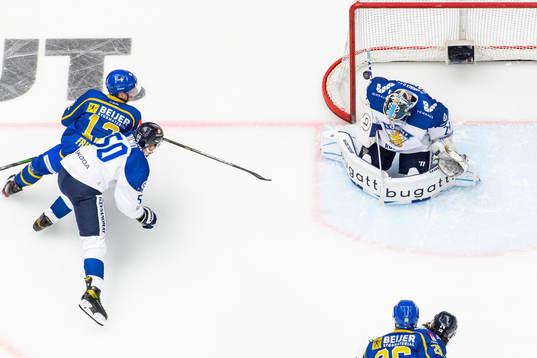 Max Friberg of Sweden scores 1-0 behind goalkeeper Harri