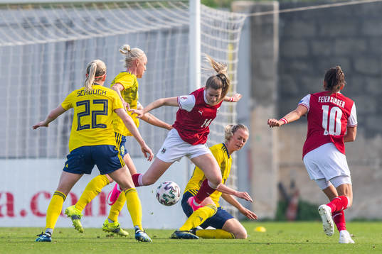 Marie-Therese Höbinger of Austria compete for the ball