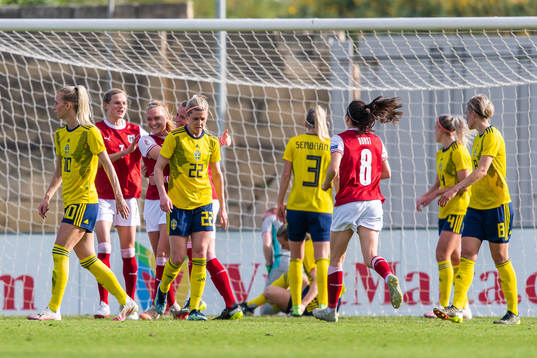 Virginia Kirchberger of Austria celebrates with team mates
