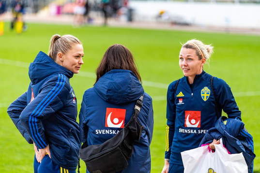 Fridolina Rolfö and goalkeeper Jennifer Falk of Sweden