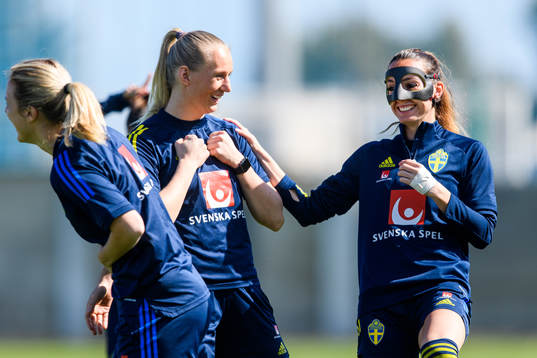 Stina Blackstenius and Kosovare Asllani in a protective