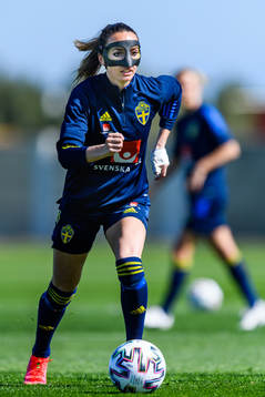 Kosovare Asllani in a protective mask worn due to a nose