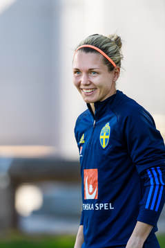Goalkeeper Jennifer Falk is interviewed by the media