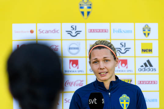 Goalkeeper Jennifer Falk is interviewed by the media