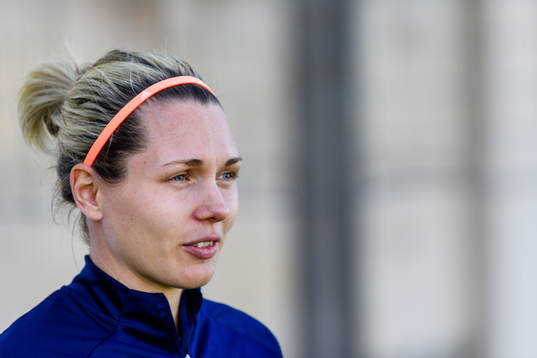 Goalkeeper Jennifer Falk is interviewed by the media
