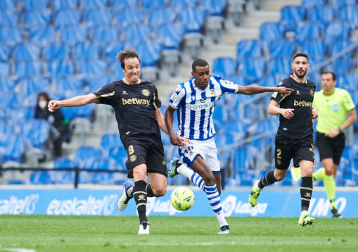 Alexander Isak of Real Sociedad duels for the ball with