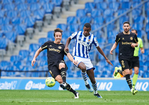Alexander Isak of Real Sociedad duels for the ball with