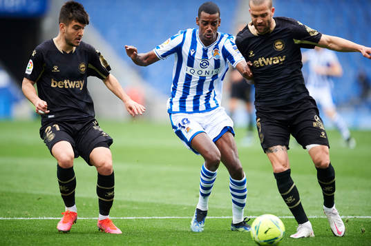 Alexander Isak of Real Sociedad duels for the ball with