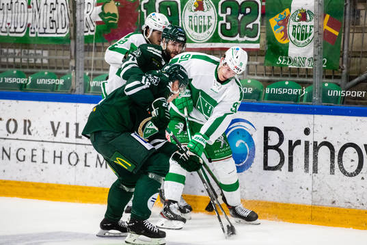 Färjestads Niclas Lundgren och Rögles Adam Tambellini i