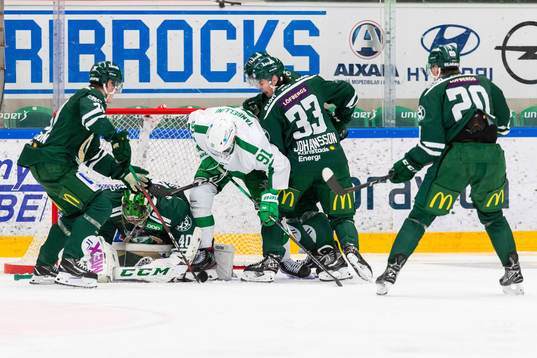 Färjestads målvakt Henrik Haukeland, Albert Johansson och