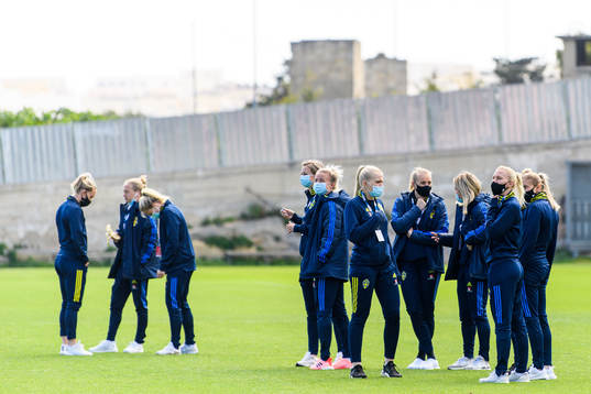 Players walk the pitch
