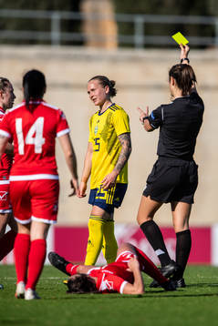 Filippa Curmark of Sweden receives a yellow card from the