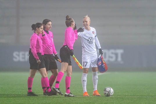 Caroline Seger of Rosengård shake hands with the referees