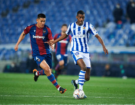 Alexander Isak of Real Sociedad duels for the ball with