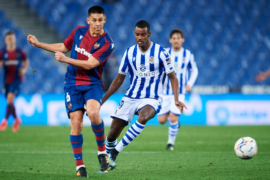 Alexander Isak of Real Sociedad duels for the ball with