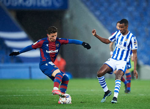 Alexander Isak of Real Sociedad duels for the ball with