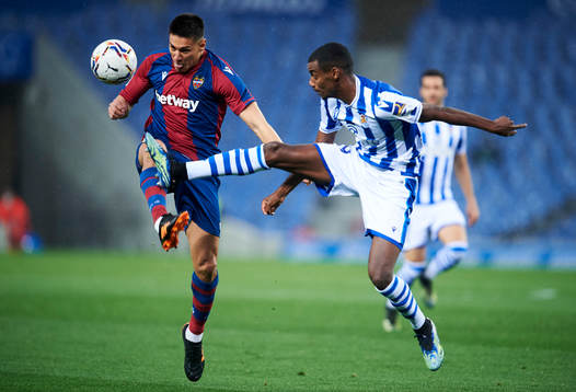 Alexander Isak of Real Sociedad duels for the ball with