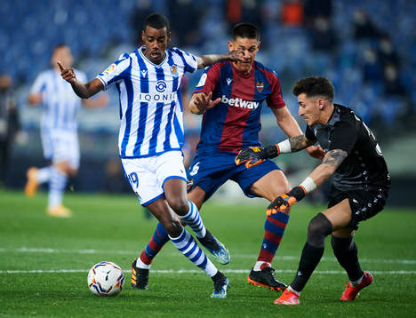 Alexander Isak of Real Sociedad duels for the ball with