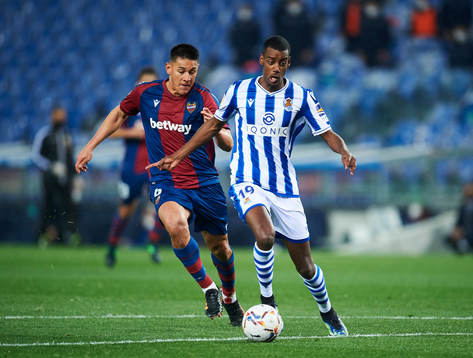 Alexander Isak of Real Sociedad duels for the ball with