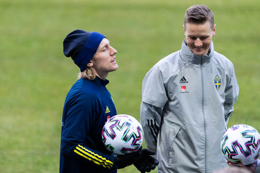 Emil Forsberg and goalkeeper coach Mats Elfvendahl of the