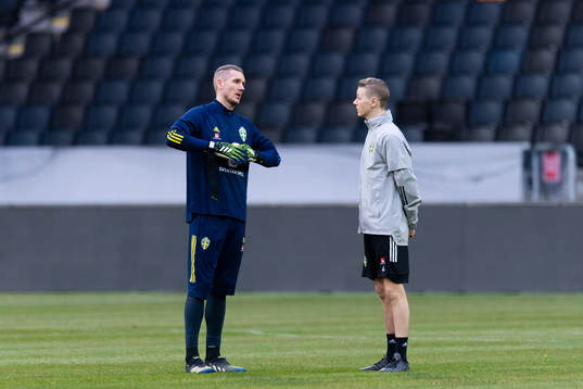 Robin Olsen and goalkeeper coach Mats Elfvendahl of the