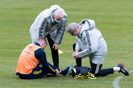 Emil Krafth of the Swedish national football team receives