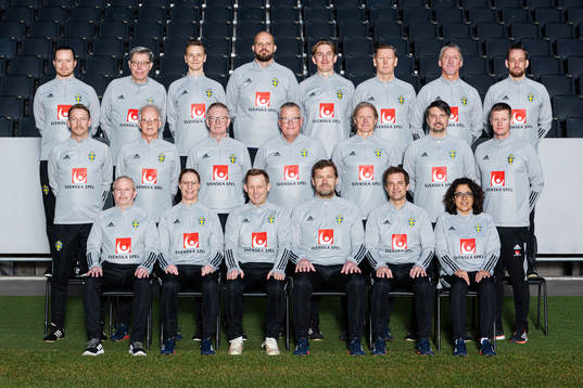 Staff of the Swedish national football team pose for a