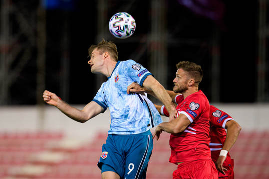 Alexander Sørloth of Norway and Scott Wiseman of Gibraltar