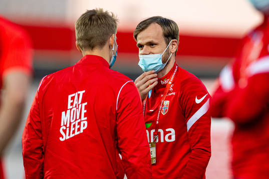 Iver Fossum talks to teammate Martin Ødegaard of Norway