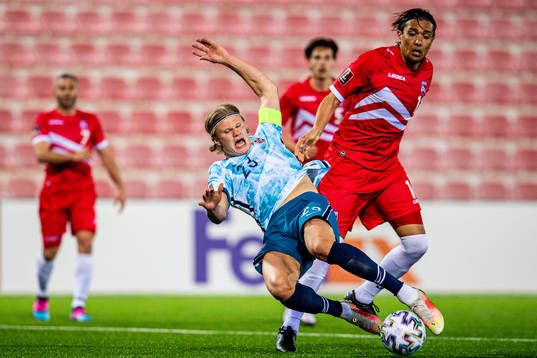 Erling Braut Haaland of Norway and Aymen Mouelhi of
