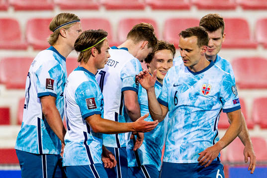 Jonas Svensson of Norway celebrates with teammates Erling