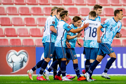 Jonas Svensson of Norway celebrates with teammates Patrick