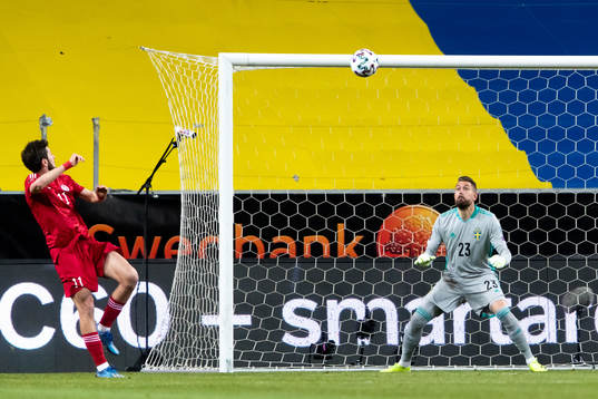 Giorgi Kvilitaia of Georgia and goalkeeper Kristoffer