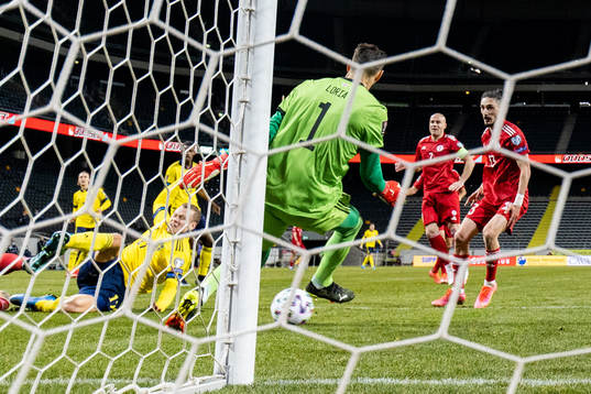 Viktor Claesson of Sweden scores 1-0 passed goalkeeper